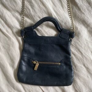 Mini Foley + Corinna crossbody black snake leather bag.